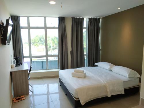 A bed or beds in a room at M Design Hotel @ Bangi 7