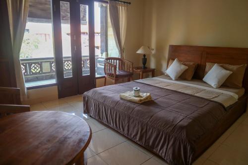 Postel nebo postele na pokoji v ubytování Ubud Canti House