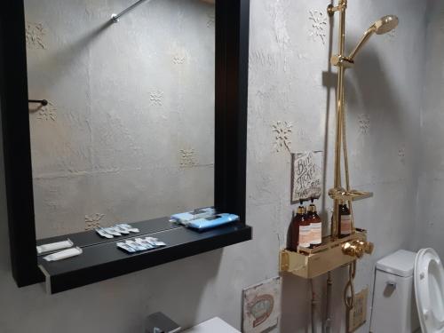 Ein Badezimmer in der Unterkunft La Masion Benie