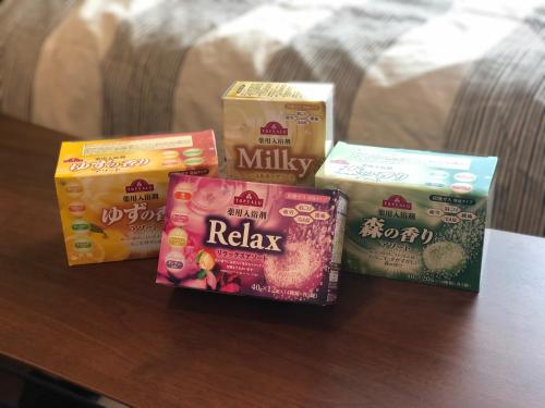 four different types of snacks on a table at Reve K 302 in Naha
