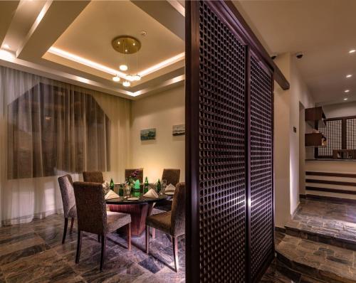 a dining room with a table and chairs at Sahab Resort and Spa, Jabal Al Akhdar in Al ‘Aqar