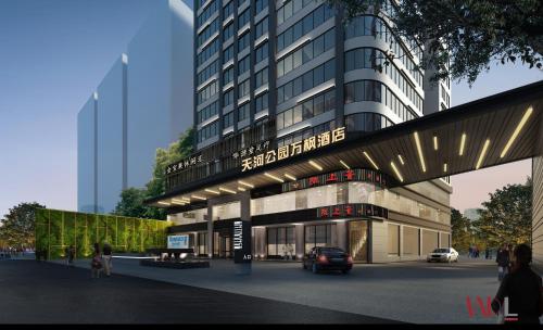 un rendimiento de un edificio con un coche delante en Fairfield by Marriott Guangzhou Tianhe Park, en Guangzhou