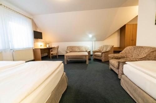 Ein Bett oder Betten in einem Zimmer der Unterkunft Pension & Restaurant Nordstern