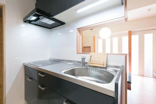 Guesthouse Tonton Nobu tesisinde mutfak veya mini mutfak