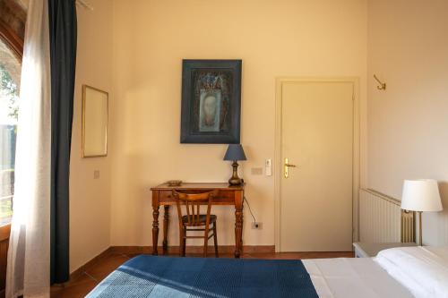 Ένα ή περισσότερα κρεβάτια σε δωμάτιο στο Villa Le Caggia