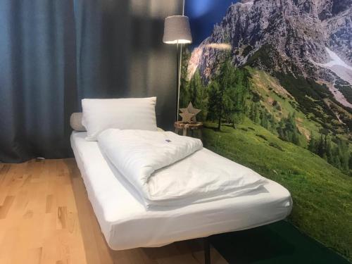 Postel nebo postele na pokoji v ubytování Wellnessapartment Alpenland Top 22