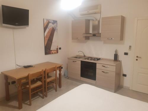A kitchen or kitchenette at Nel Sole monolocale