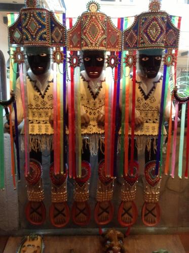 a display of three men dressed in indian costumes at Hotel Regis in Uruapan del Progreso