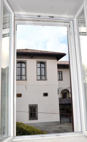 a view from a window of a white building at B&B Il Torchio in Calco
