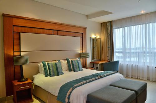 Voodi või voodid majutusasutuse BON Hotel Waterfront Richards Bay toas