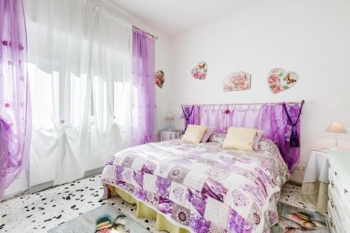 Łóżko lub łóżka w pokoju w obiekcie Le Tamerici