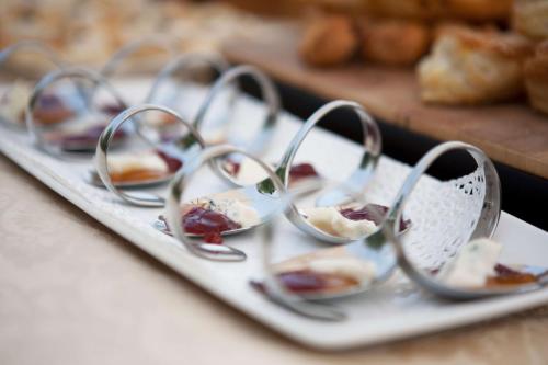 a tray of mini dessert dishes on a plate at Country House Barone D'Asolo in Asolo