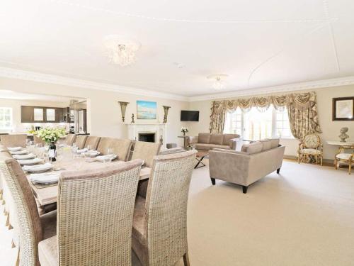 
a living room filled with furniture and a table at Waterside Cornwall in Bodmin
