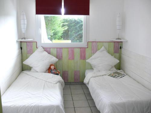 Postel nebo postele na pokoji v ubytování Gîte la Sapinière
