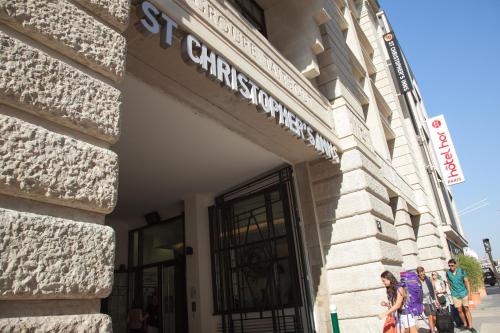 a building with a sign on the side of it at St Christopher's Inn Paris - Gare du Nord in Paris