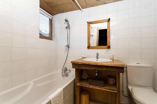 A bathroom at CHALET PELE - Alpes Travel - Central Chamonix - Sleeps 11