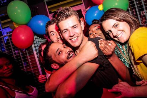 a group of people posing for a picture at a party at St Christopher's Inn Paris - Gare du Nord in Paris