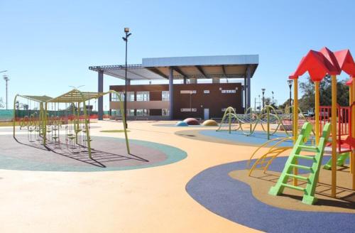 an empty playground with slides and a play structure at Departamento Moritan in Posadas