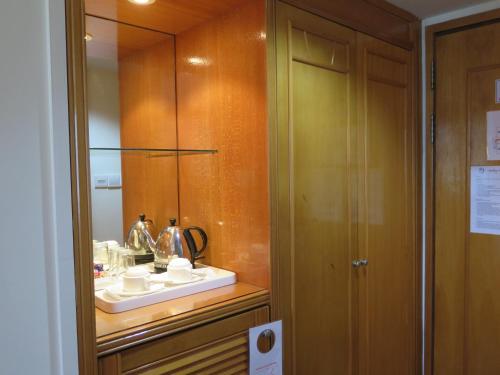 a bathroom with a sink and a mirror at Sea View Resort Hotel & Apartments in Kuala Belait
