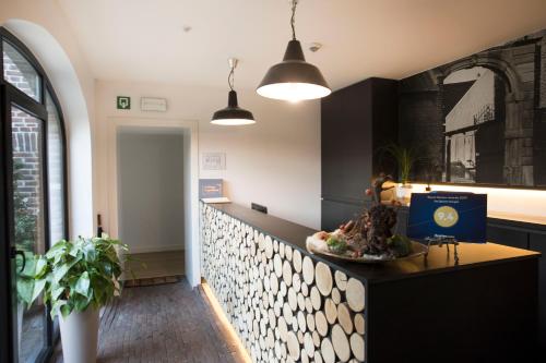 a kitchen with a bowl of food on a counter at De Sjeiven Dorpel in Maaseik