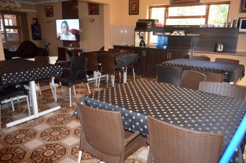 a restaurant with tables and chairs in a room at ST@Y-1-BnB in Cape Town