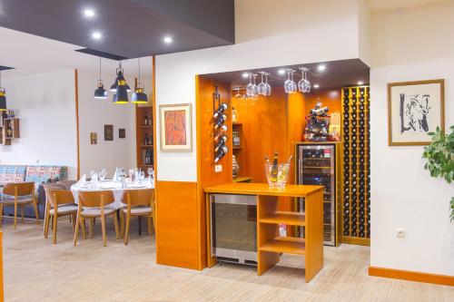 a dining room with a table and chairs at Spa Hotel Spartak in Sandanski