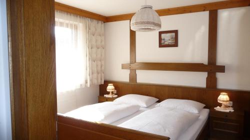 En eller flere senge i et værelse på Haus Rieder Georg