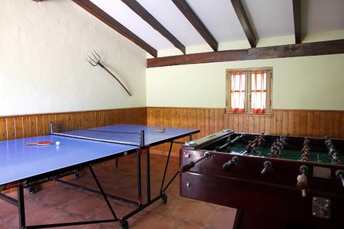 a room with two ping pong tables in it at Casa Katton in Etxalar