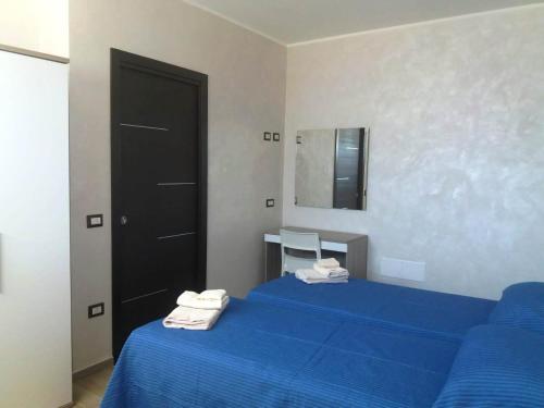 Katil atau katil-katil dalam bilik di La Playa Del Sol Tropea