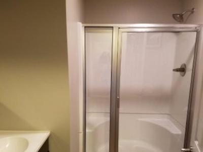 a bathroom with a shower and a sink at Grand View Resort in Weirs Beach