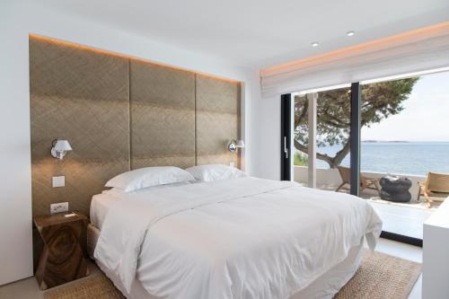 Ένα ή περισσότερα κρεβάτια σε δωμάτιο στο The Margi Villa