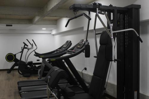 a gym with several exercise bikes in a room at Hotel Tayko Bilbao in Bilbao