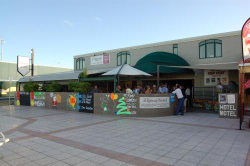 a group of people standing outside of a building at Slipway Hotel Motel in Ballina