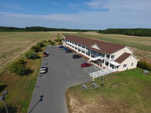 an aerial view of a large building with a parking lot at Shore Stay Suites in Cape Charles