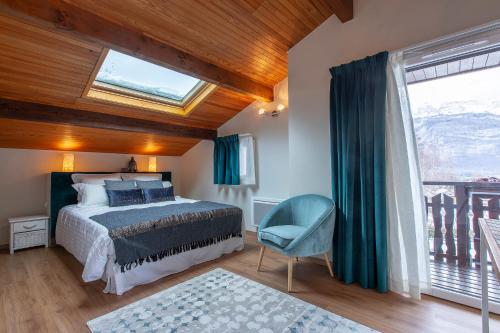 a bedroom with a bed and a window at Le Catarina in Lathuile