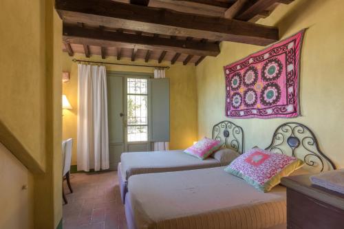 Postel nebo postele na pokoji v ubytování Podere San Niccola