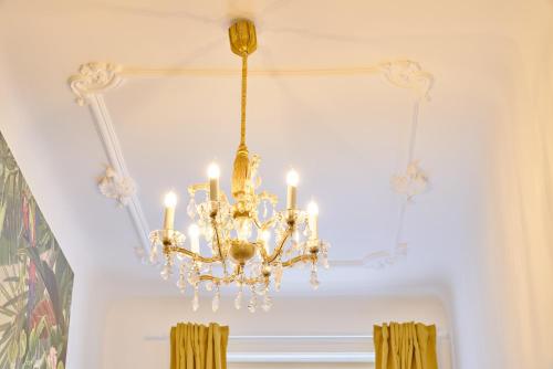 a chandelier hanging from a ceiling in a room at Leuhusen Collection Vienna, Wien in Vienna