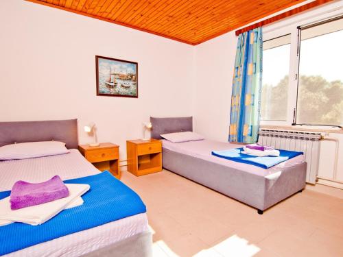 Posteľ alebo postele v izbe v ubytovaní Mali Losinj Apartment 6