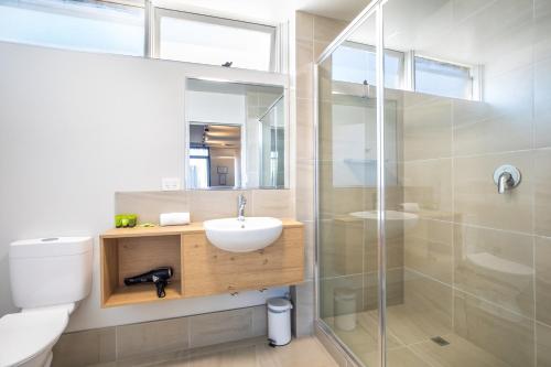 a bathroom with a toilet and a sink and a shower at Nightcap at Westside Hotel in Laverton