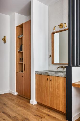 a bathroom with a sink and a mirror at Lokal Hotel Fishtown in Philadelphia