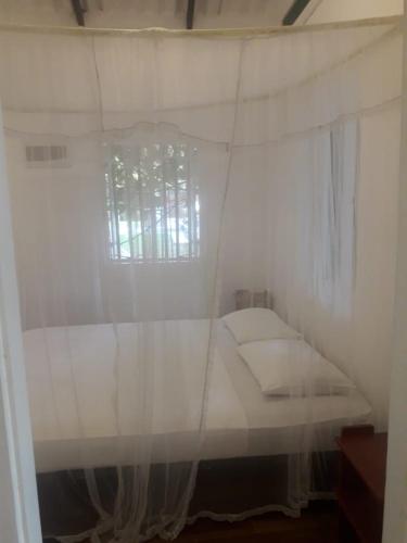 Ένα ή περισσότερα κρεβάτια σε δωμάτιο στο Hostel Residence Bentota