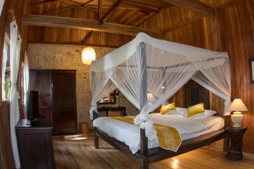 Un ou plusieurs lits dans un hébergement de l'établissement Siladen Resort & Spa