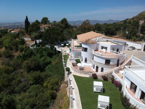 an aerial view of a house on a hill at Mijas Residence in Mijas