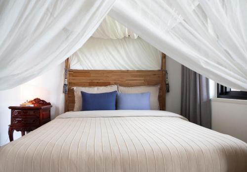 מיטה או מיטות בחדר ב-Casa Bonbon
