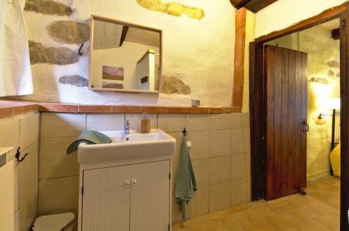 a bathroom with a sink and a mirror at La Girandola in Cupramontana