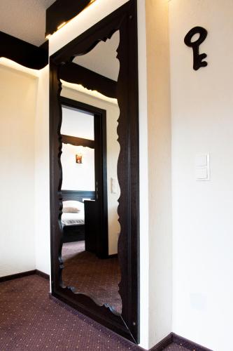a mirror on a wall in a room at Domeniul Dornei in Vatra Dornei