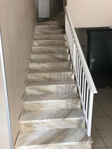a staircase with marble treads in a house at Kentrikon in Chalkida