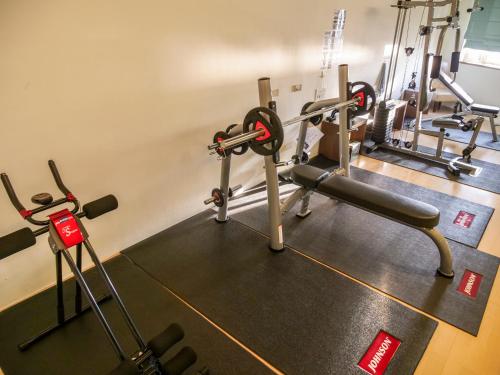 a gym with treadmills and cardio machines at MF Hotel, penghu in Magong