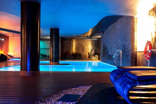 a large swimming pool in a house at Lisotel - Hotel & Spa in Leiria