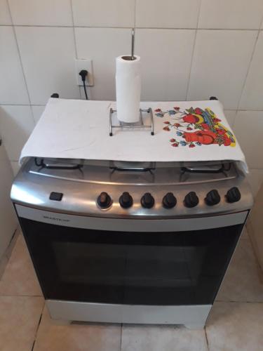 a stove with a paper towel on top of it at Great Moments Copacabana in Rio de Janeiro